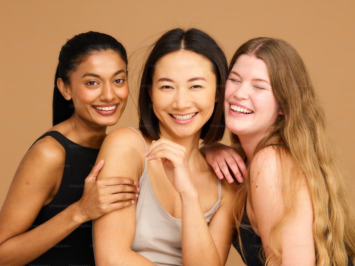 Three women smiling together